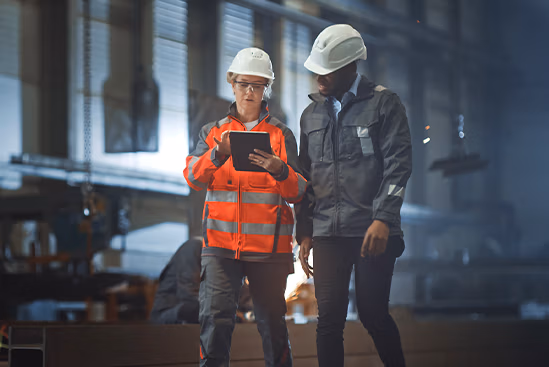 Two workers on Ipad