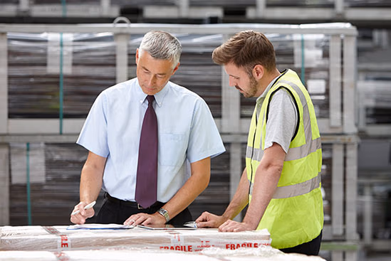 Two men looking at drawings